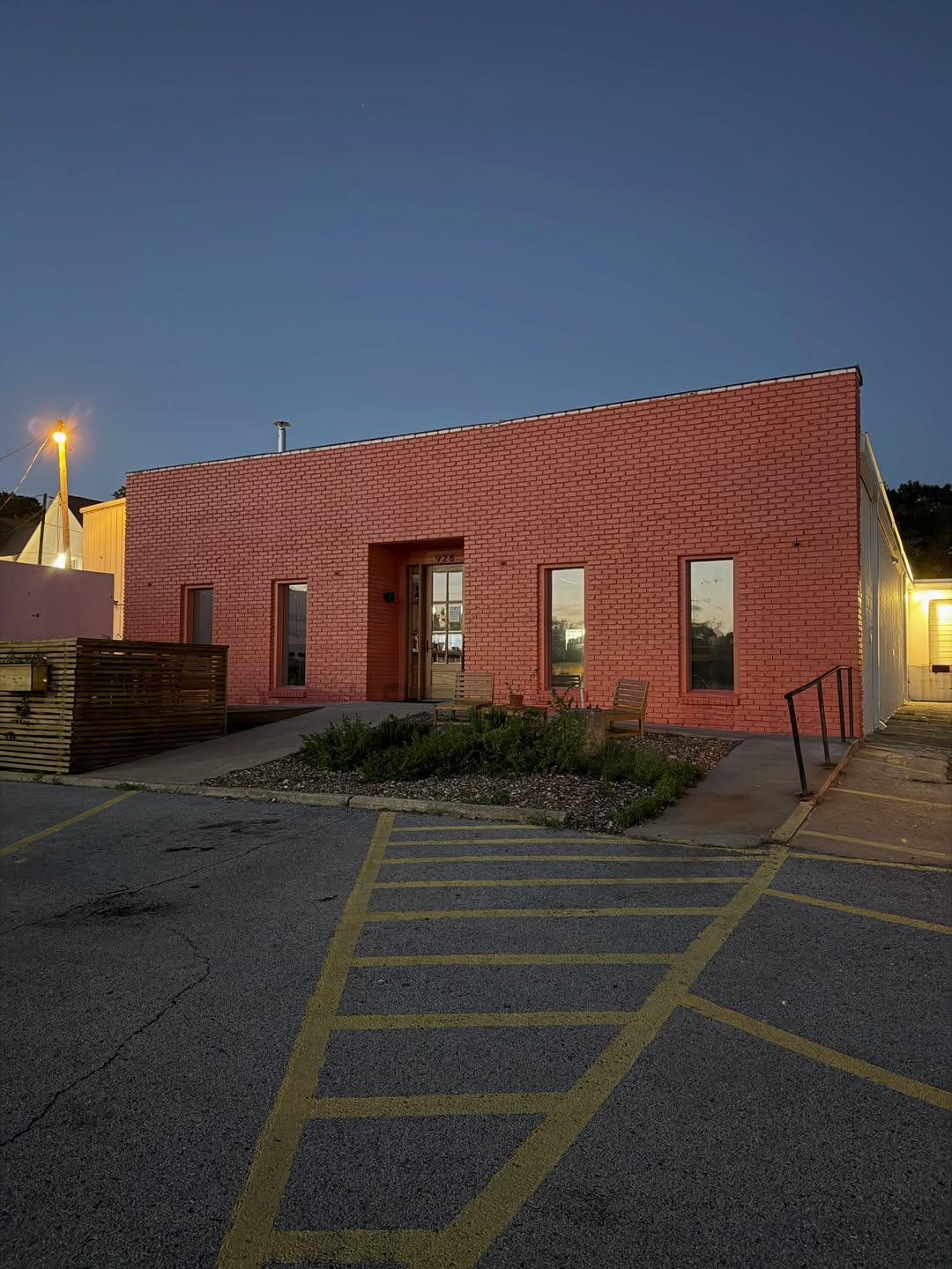 Coral brick commercial building at dusk