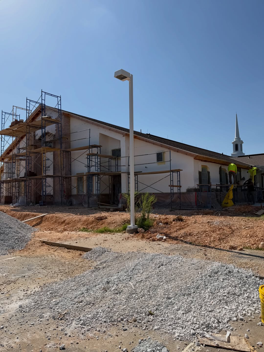 Church exterior with fresh white stucco in progress