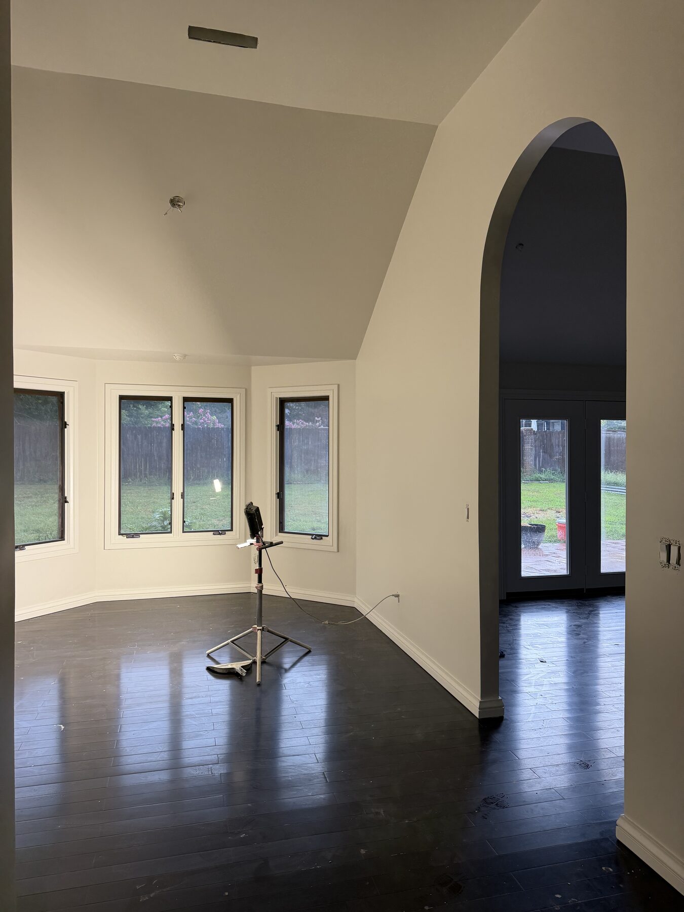 Interior with arched opening and fresh wall and ceiling paint